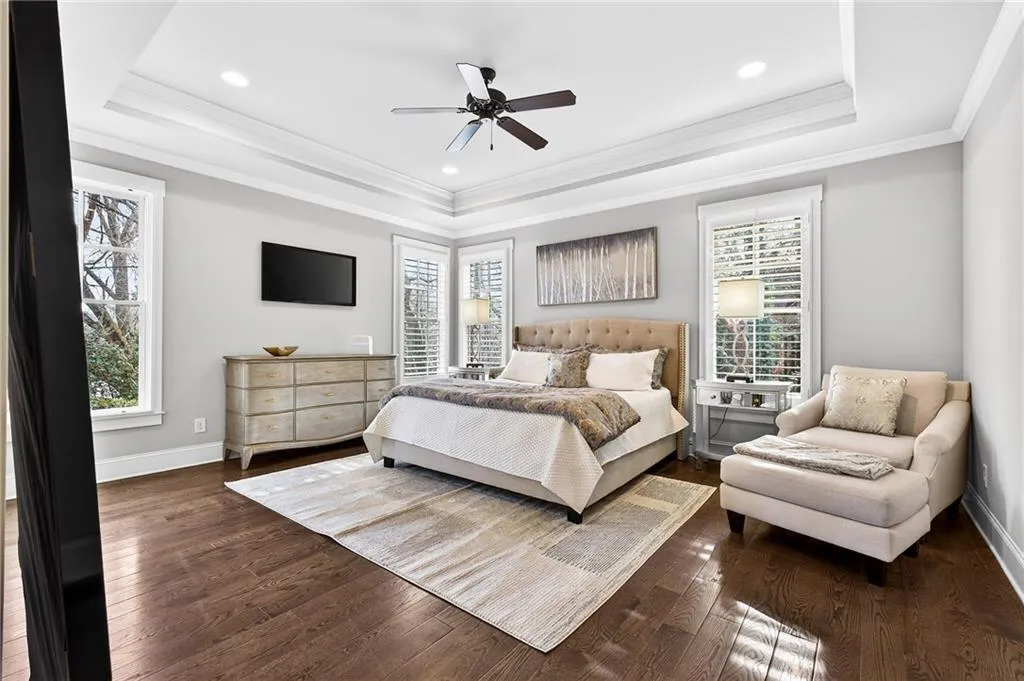 Main level Bedroom suite perfect for in-law or guest suite. Multiple windows, trey ceiling with fan, and private bath