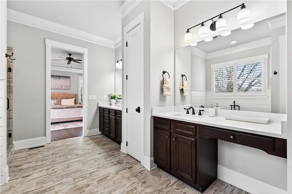 Main level ensuite bath with dual vanities, soaking tub and separate shower