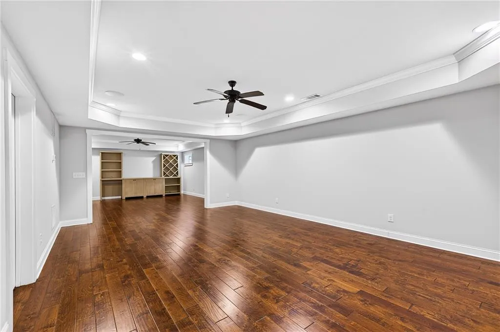 Open living space in basement, perfect for additional family room, enterainment room, game room, separate office space available, endless options