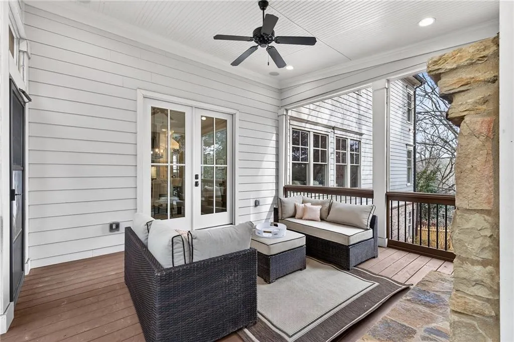 Wooden deck featuring an outdoor living space, french doors, and ceiling fan