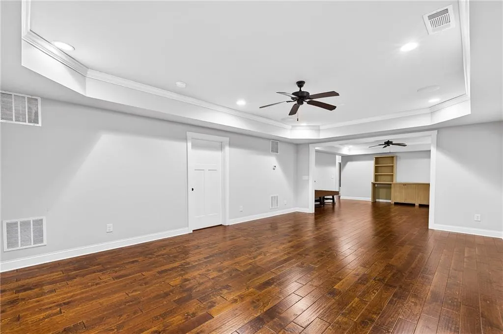 Open living space in basement, perfect for additional family room, enterainment room, game room, separate office space available, endless options