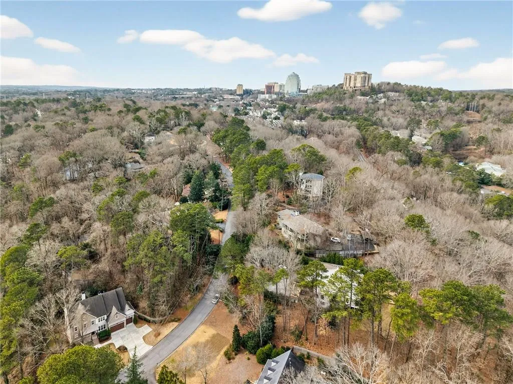 Aerial view of property's location with nearby urban area