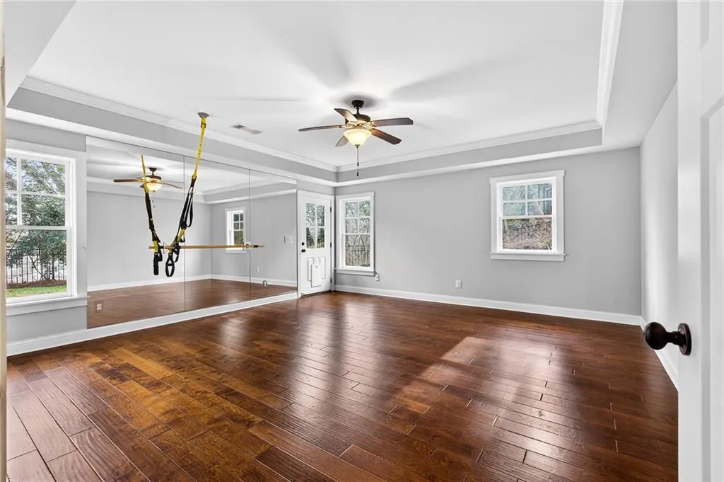 Exercise room with exterior entrance to side yard