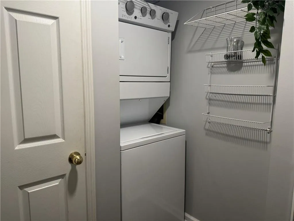 Washroom featuring estacked washer and dryer