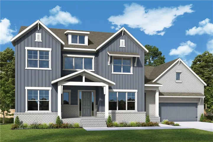 Two-story residence featuring a covered front porch, an attached two-car garage, and a combination of vertical siding and brick exterior finishes