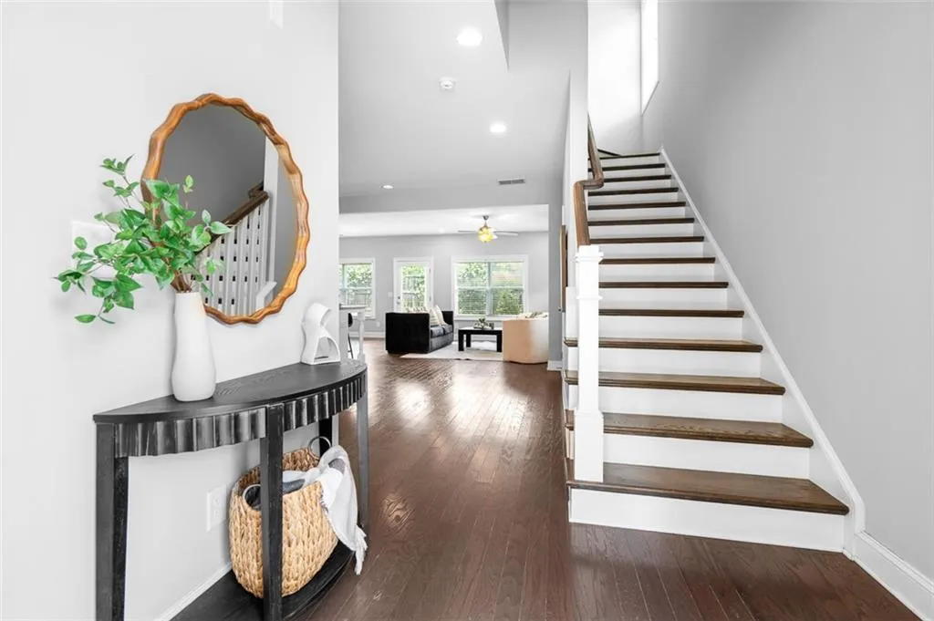 Stairs featuring ceiling fan, wood-type flooring, and recessed lighting