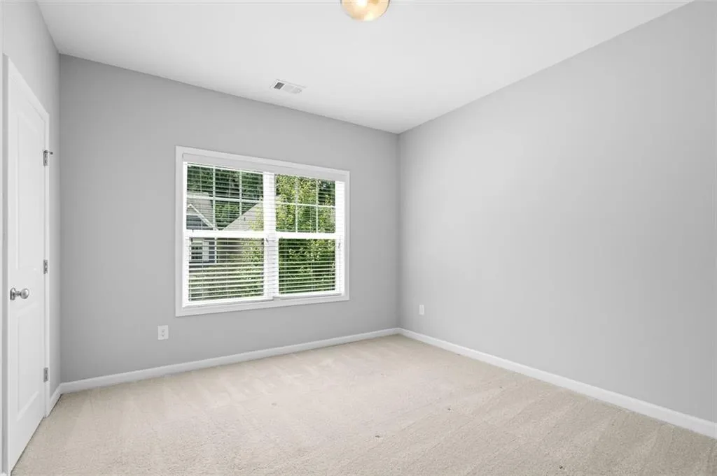 Unfurnished room featuring carpet