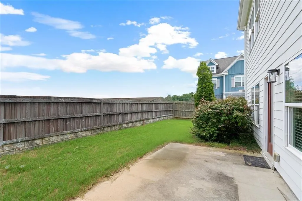 Fenced backyard featuring a patio area