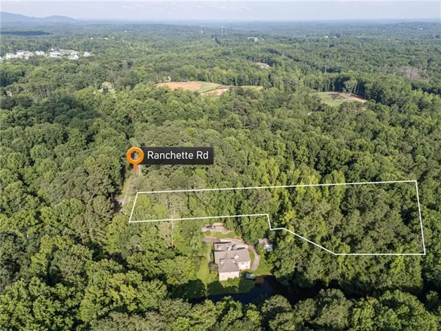 Aerial view of property's location with property parcel outlined