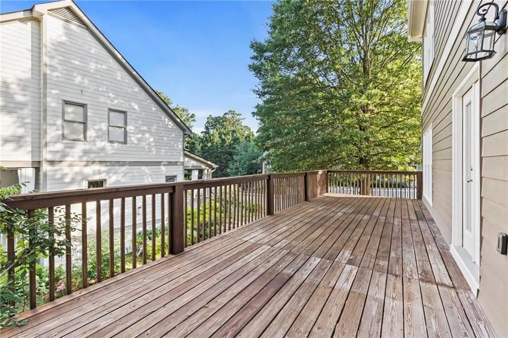 View of large wooden deck off the kitchen