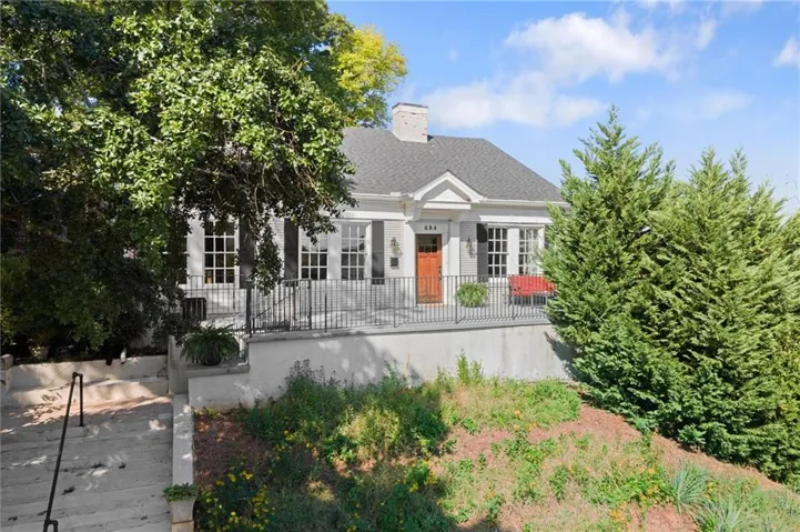 684 Kennesaw- sitting above street level. Park behind the home for no stairs.