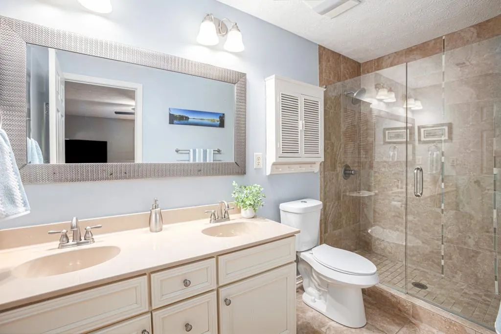 Owner's Ensuite With Dual Vanities & Large Tiled Shower