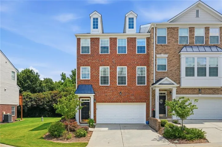 Welcome to Chattahoochee Bluffs! 1 of 5 hiking trails to the river is just behind this end unit townhome.