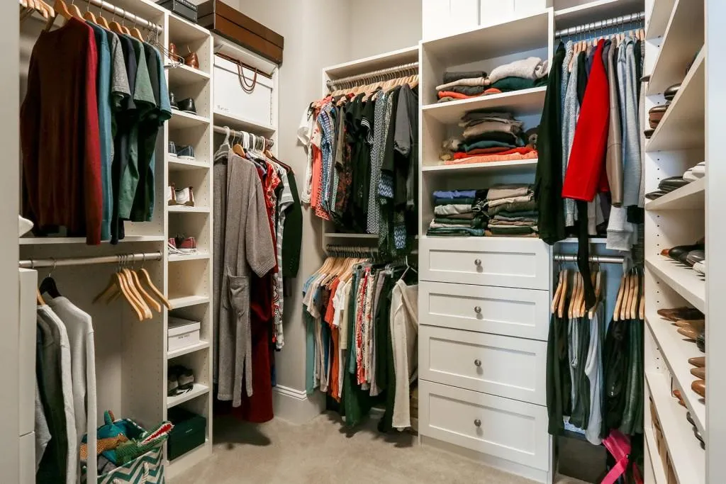 Walk-in master closet with custom built-ins. Every closet in this home has custom closets that were added after the Sellers bought this townhouse.