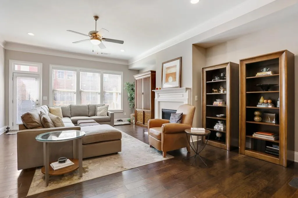 The living room opens to a private deck in the back of the townhouse.