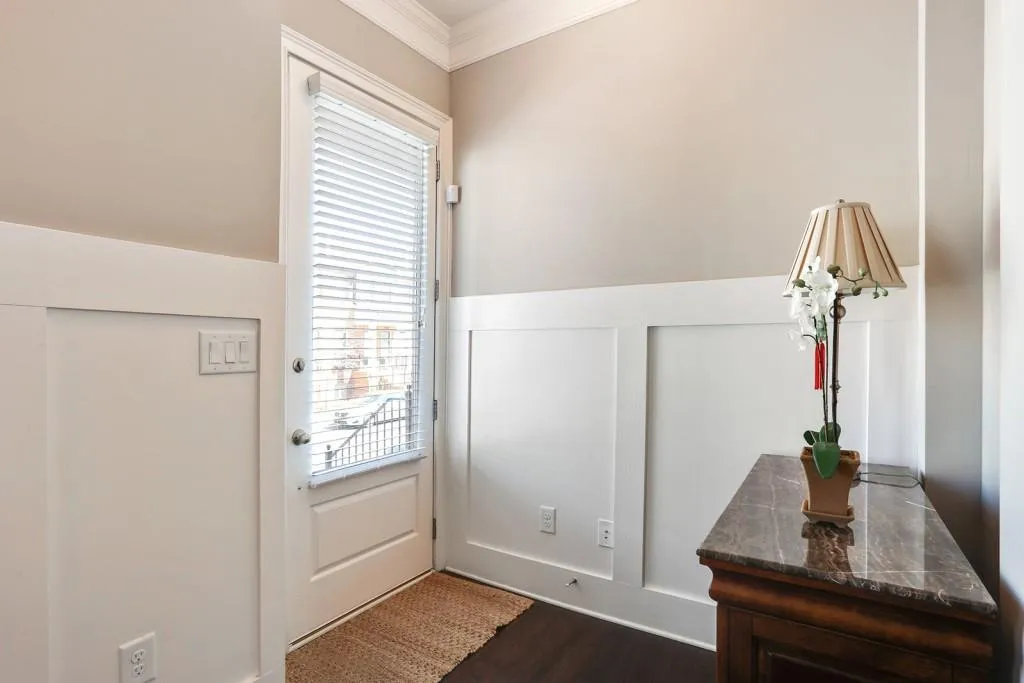 Entrance foyer has upgraded wainscoting trim.