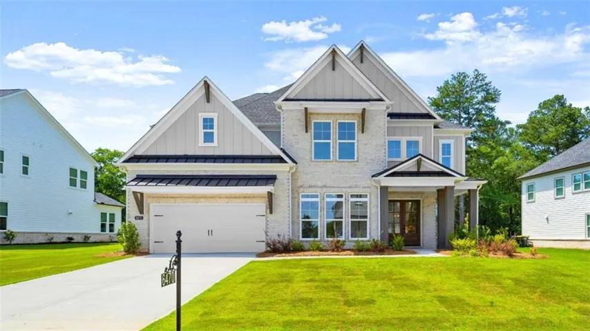 Modern brick and siding exterior with a multi-gabled roofline