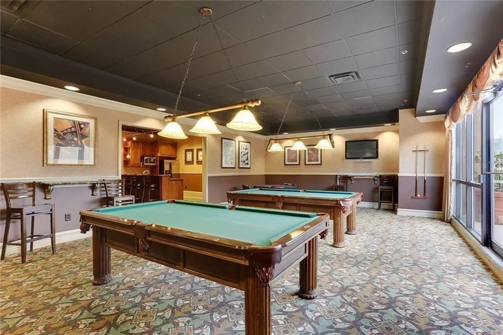 The billiards room is a great space for lounging or hosting an event.