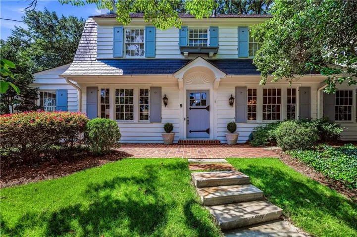 Timeless curb appeal welcomes you to this classic Brookwood Hills residence.