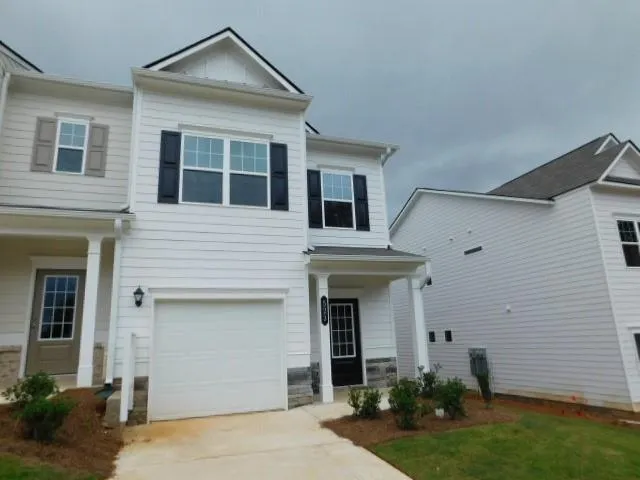 White siding exterior with a dark shingle roof