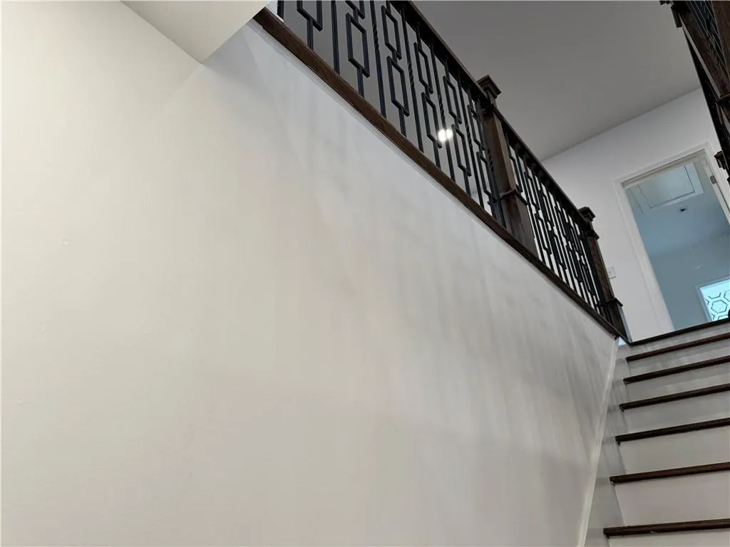 Stairway featuring a high ceiling