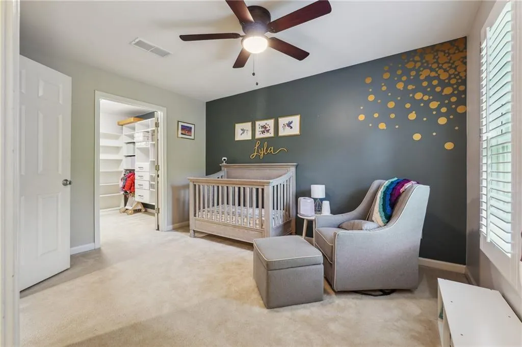 One of two secondary bedrooms (and a separate playroom) upstairs