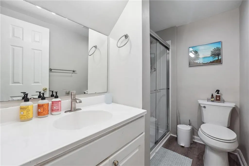 Basement bathroom - recently renovated with expanded shower and new flooring+paint