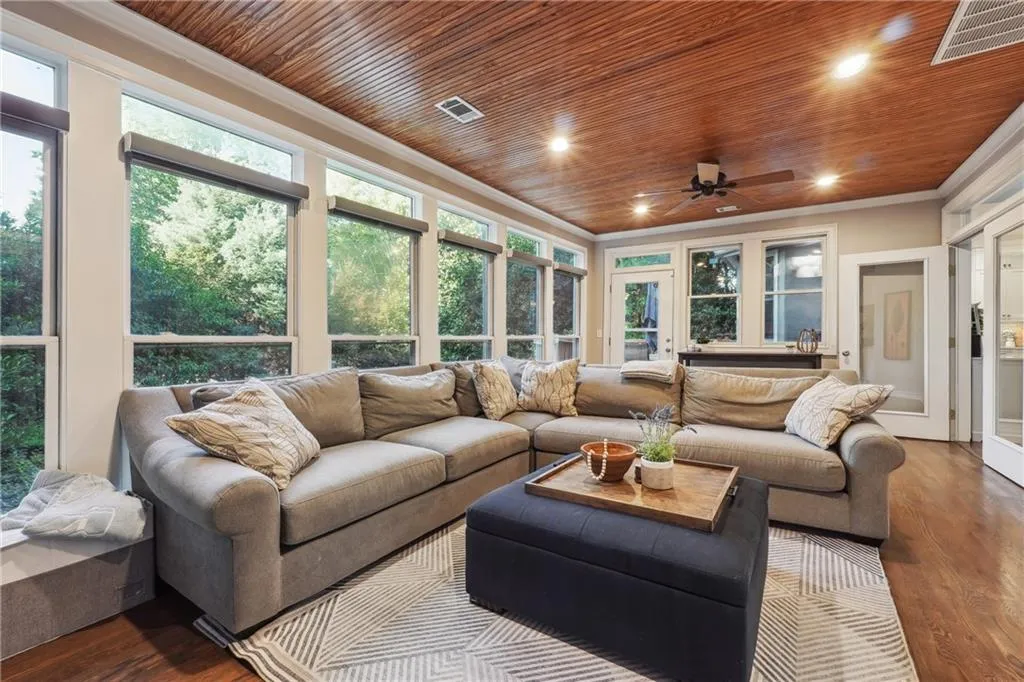 The huge sunroom just off the main living area and primary bedroom is the BEST for family hang outs, tailgates, and movie nights.