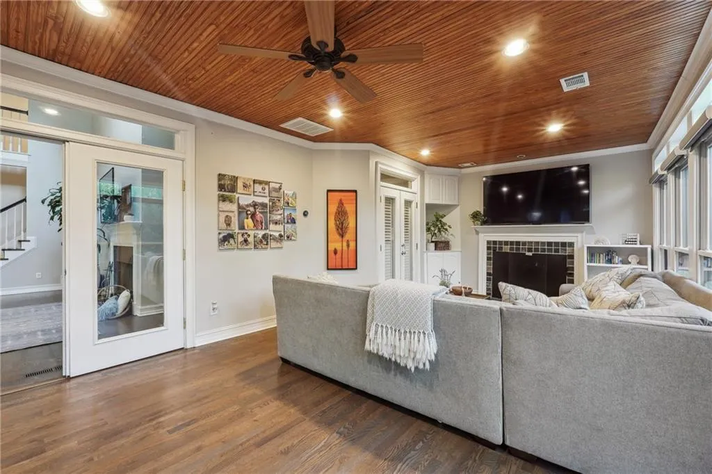 The huge sunroom just off the main living area and primary bedroom is the BEST for family hang outs, tailgates, and movie nights.