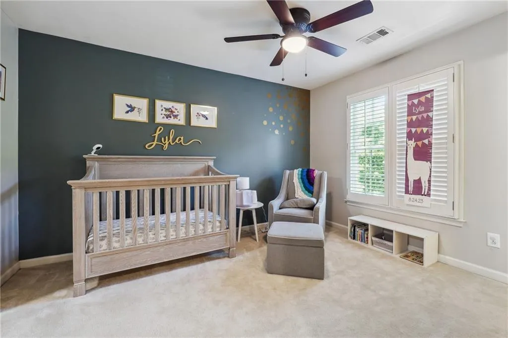 One of two secondary bedrooms (and a separate playroom) upstairs
