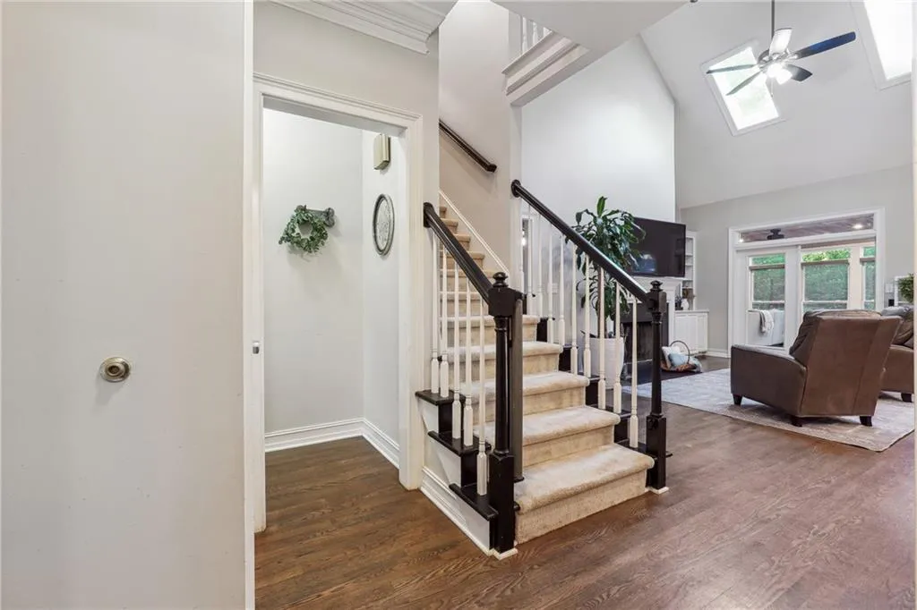 The entry foyer greets you with tall ceilings, tons of natural light, and a view to the main level's open floorpan