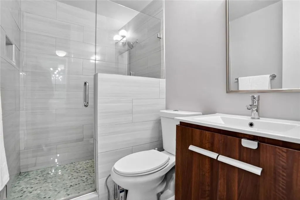 Bathroom with a stall shower and vanity