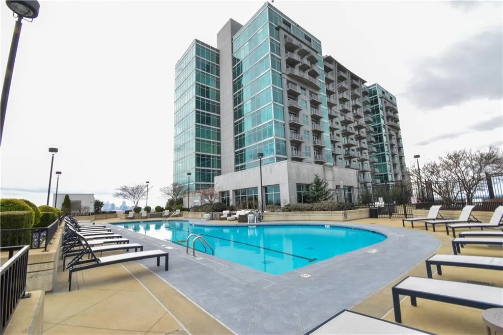 Community pool featuring a patio area
