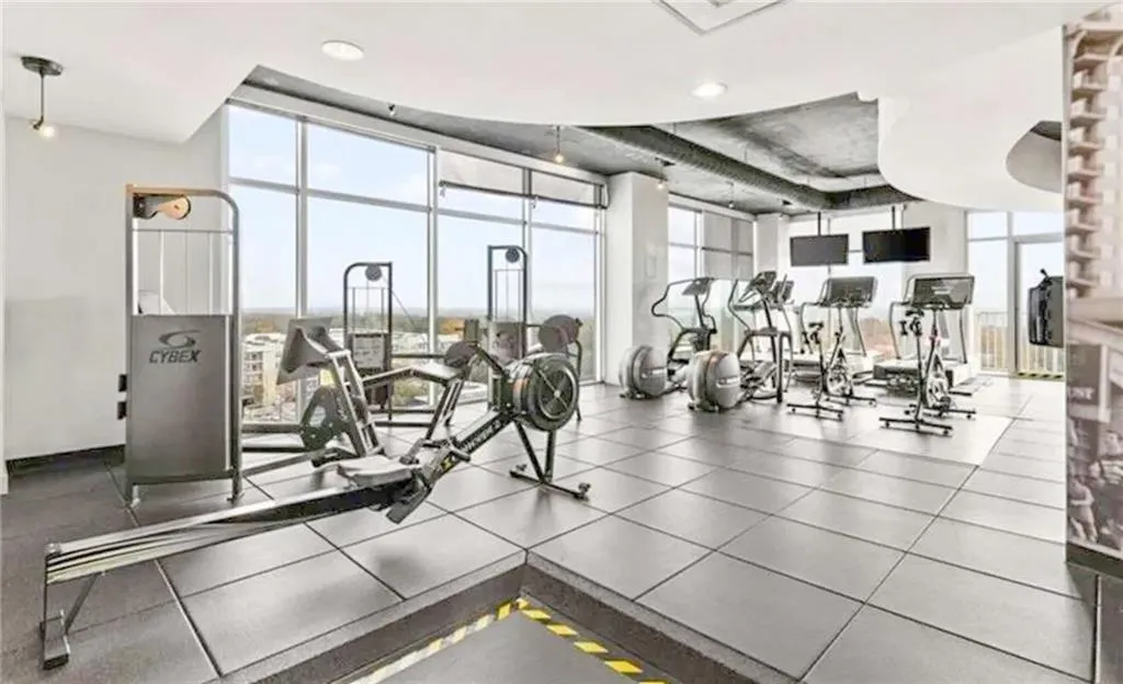Gym with floor to ceiling windows