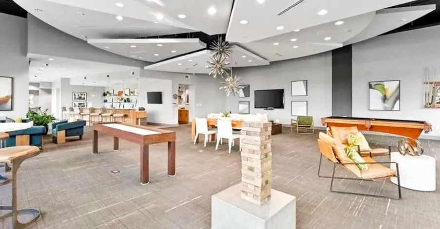 Rec room with billiards table and a high ceiling