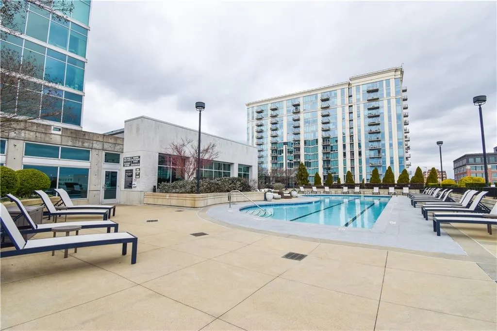 Community pool featuring a patio