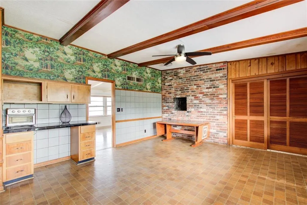 Spacious eat in kitchen opens to the fireside family room