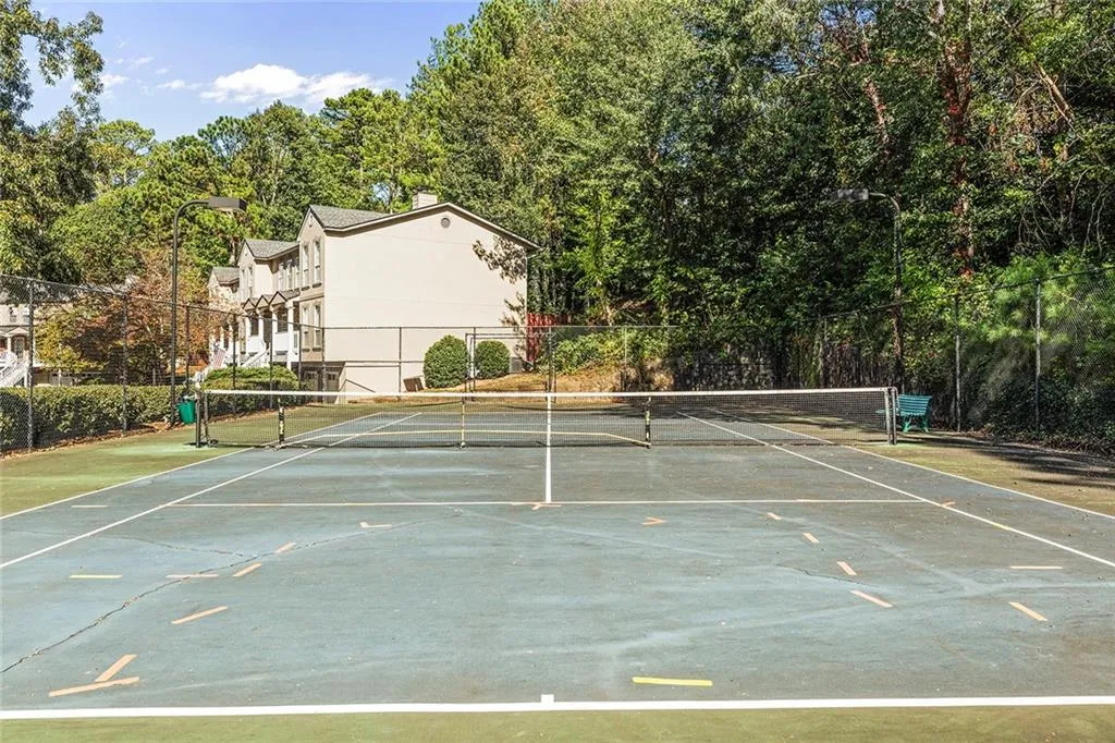 View of sport court featuring fence