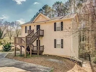Two Story Exterior with light-colored siding