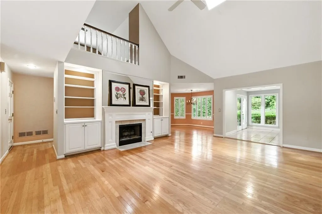 LR with View to Dining Room and Sunroom
