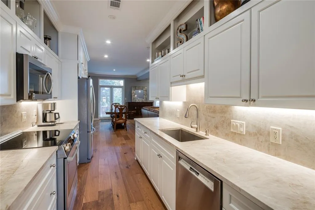 Renovated Kitchen with newer SS appliances and leathered quartz countertops