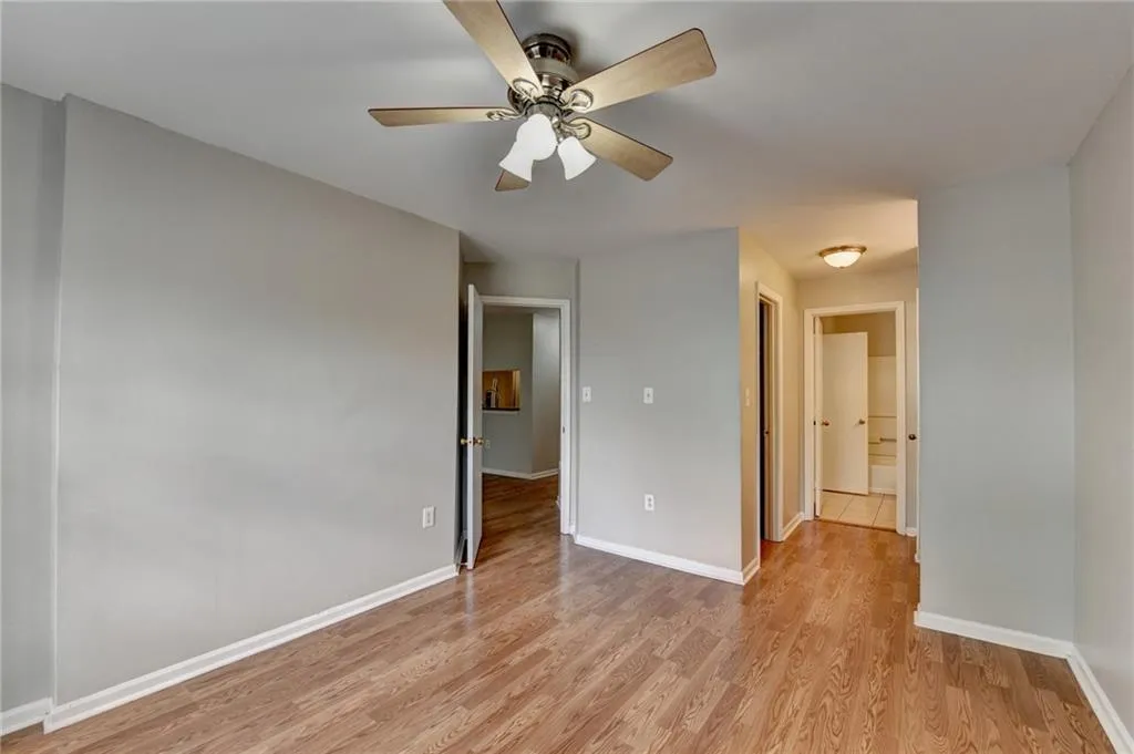 Unfurnished bedroom with light wood finished floors and a ceiling fan
