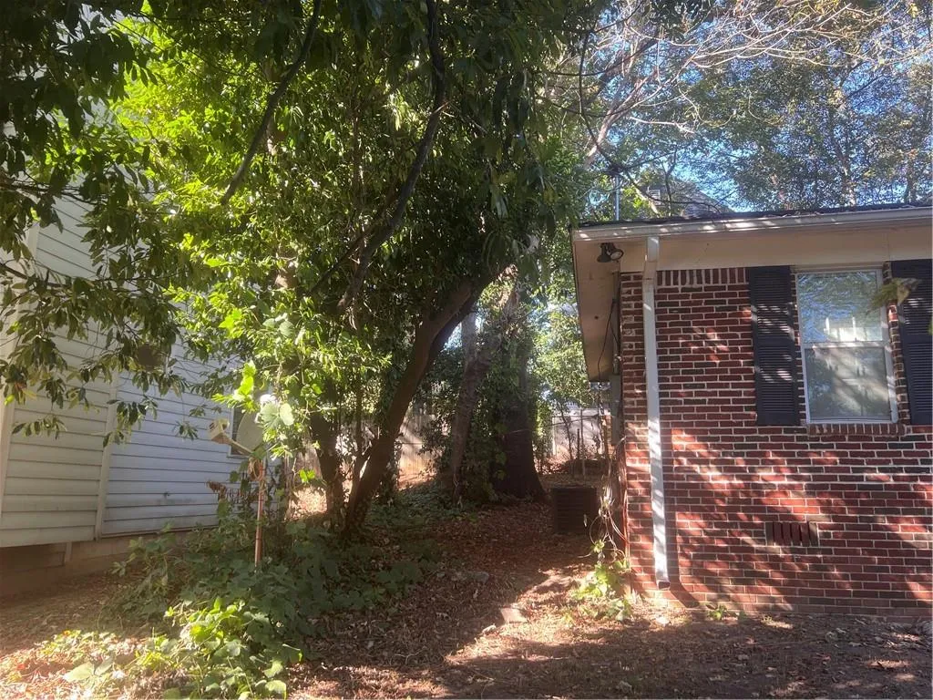 View of property exterior featuring brick siding and a central air condition unit View of property exterior featuring brick siding and a central air condition unit