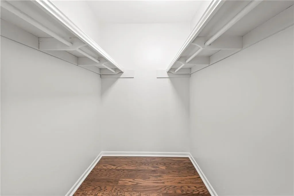 Oversized walk-in closet in primary bedroom.