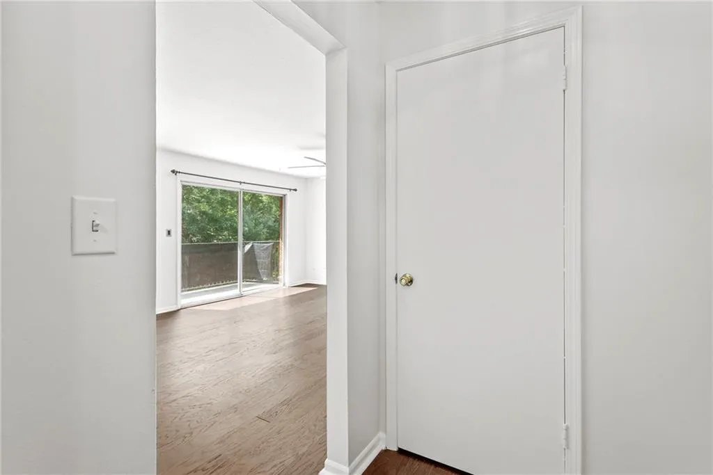 Foyer closet and view into living room