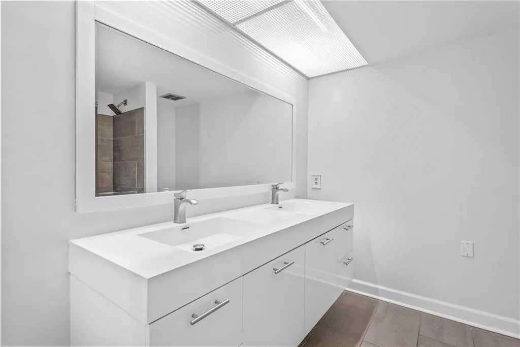 Double vanity, large mirror and great lighting
