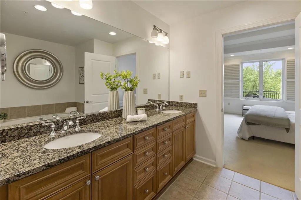 Double vanity sinks with beautiful warm wood cabinetry.