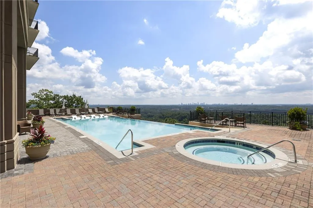 Stylish and comfy Janus et Cie outdoor furniture, spacious hot tub, tanning ledge, lap pool and observation deck makes this pool a 10/10 amenity.
