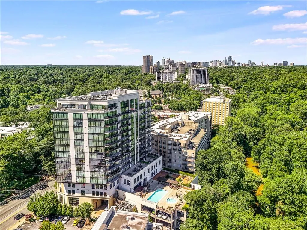 Modern high-rise residential building with extensive glass facades