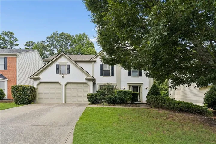 Two-story residence featuring a two-car driveway